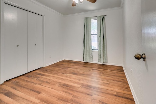 10601 Songbird Ln, Oklahoma City, OK 73130 - unfurnished bedroom with baseboards, ornamental molding, light wood-style flooring, and a closet