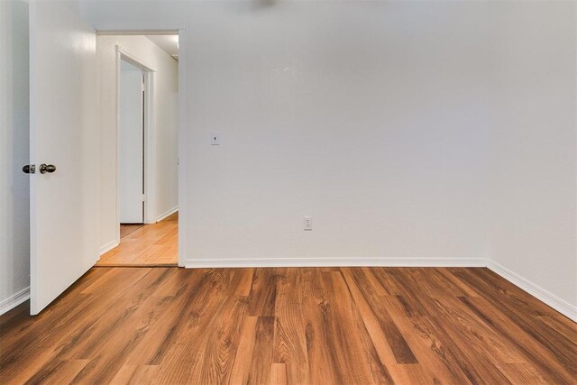 10601 Songbird Ln, Oklahoma City, OK 73130 - spare room with baseboards and wood finished floors