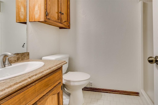 10601 Songbird Ln, Oklahoma City, OK 73130 - half bath with baseboards, tile patterned floors, toilet, and vanity