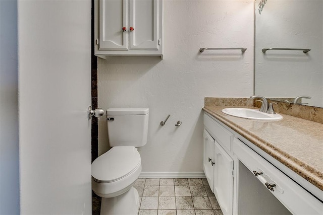 10601 Songbird Ln, Oklahoma City, OK 73130 - bathroom with baseboards, vanity, and toilet