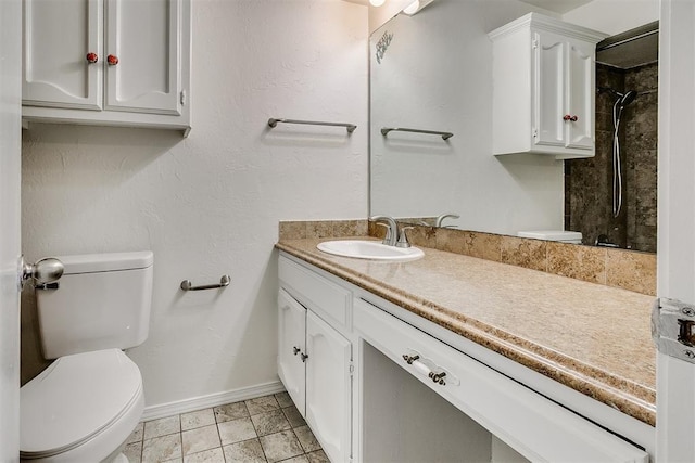 10601 Songbird Ln, Oklahoma City, OK 73130 - full bath with toilet, baseboards, walk in shower, and vanity