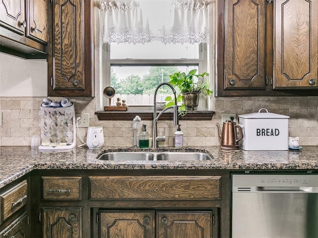 kitchen with stainless steel dishwasher, a sink, backsplash, and dark brown cabinets