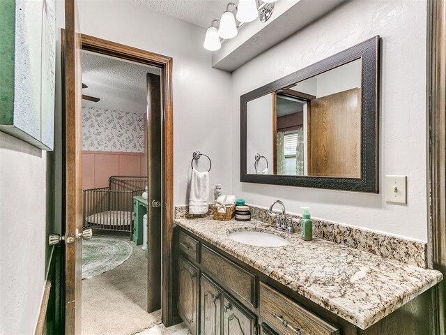 bathroom featuring vanity and a textured ceiling