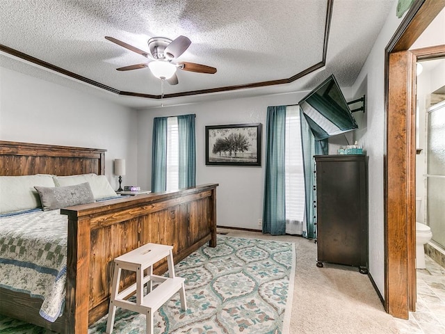 bedroom with light colored carpet, a textured ceiling, ceiling fan, and baseboards