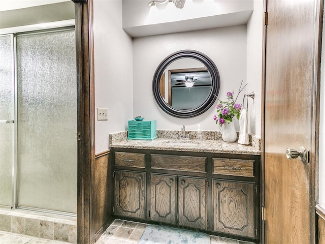 bathroom with vanity and a stall shower