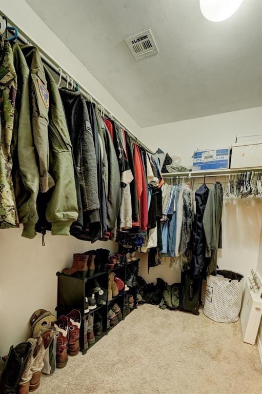 spacious closet with visible vents and carpet
