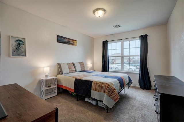 carpeted bedroom with visible vents