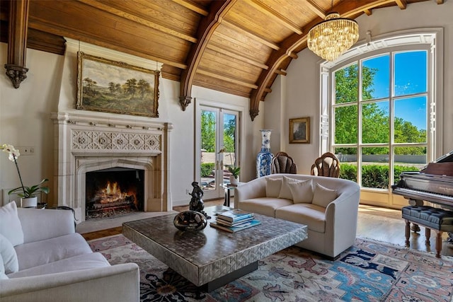 2203 E Wilshire Blvd, Oklahoma City, OK 73111 - living room featuring wood ceiling, a chandelier, wood finished floors, and a tiled fireplace