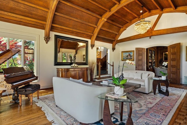 2203 E Wilshire Blvd, Oklahoma City, OK 73111 - living area with wooden ceiling, a chandelier, wood finished floors, baseboards, and arched walkways