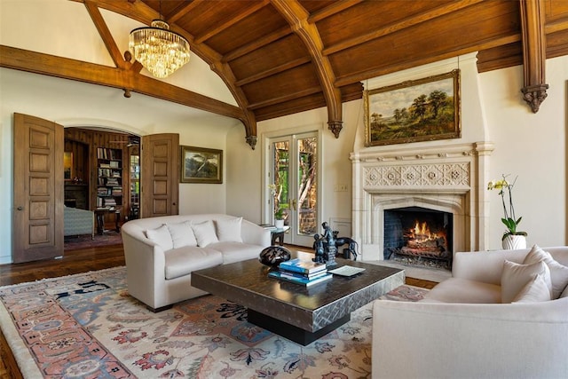 2203 E Wilshire Blvd, Oklahoma City, OK 73111 - living room with a fireplace, wood ceiling, wood finished floors, a chandelier, and arched walkways