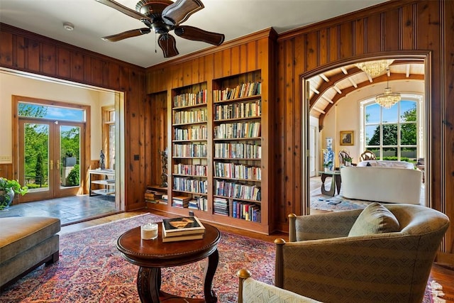 2203 E Wilshire Blvd, Oklahoma City, OK 73111 - sitting room featuring wooden walls, built in features, plenty of natural light, a chandelier, and french doors