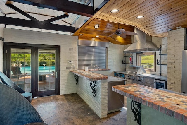 2203 E Wilshire Blvd, Oklahoma City, OK 73111 - reception featuring wood ceiling, brick wall, vaulted ceiling, recessed lighting, and ceiling fan