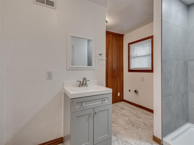 bathroom with visible vents, walk in shower, vanity, baseboards, and marble finish floor