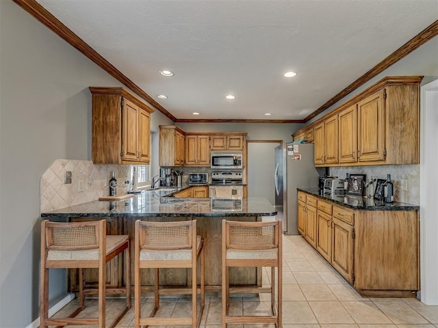 kitchen with crown molding, a peninsula, recessed lighting, appliances with stainless steel finishes, and backsplash