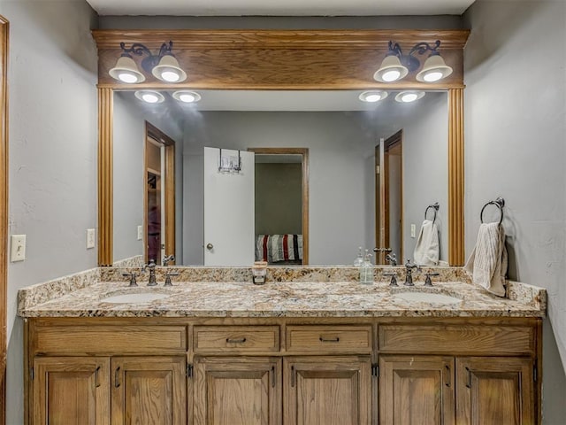 full bath featuring double vanity and a sink