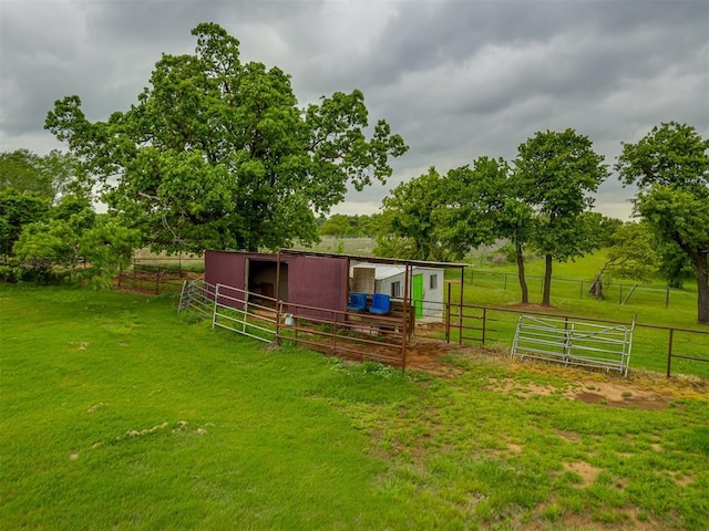 exterior space featuring an outdoor structure, an exterior structure, and a rural view