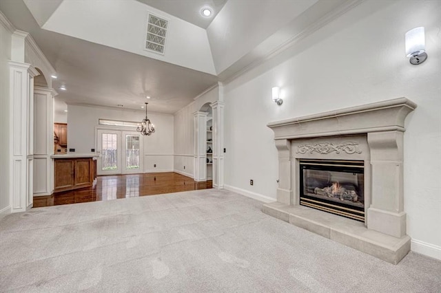 unfurnished living room with baseboards, visible vents, carpet, and a fireplace
