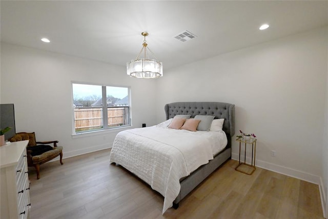 bedroom with recessed lighting, baseboards, visible vents, and light wood-type flooring