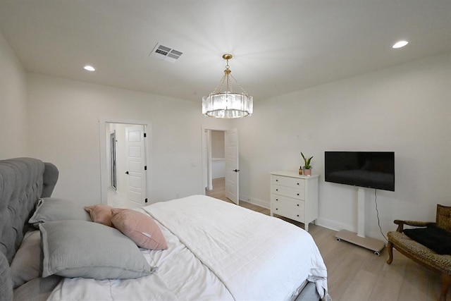 bedroom featuring recessed lighting, a chandelier, visible vents, and light wood-style flooring
