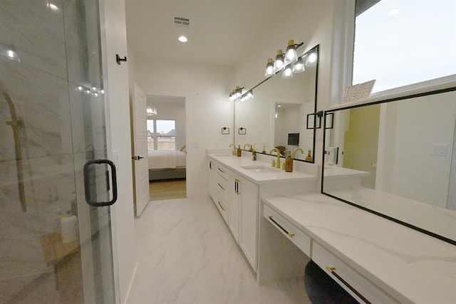 ensuite bathroom with vanity, marble finish floor, ensuite bathroom, visible vents, and a stall shower