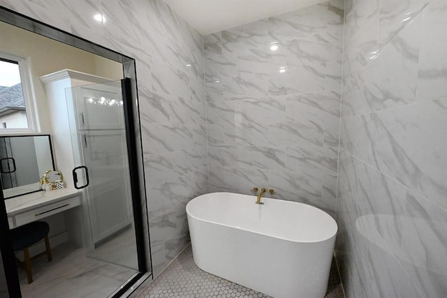 bathroom featuring tile walls, a shower stall, and a soaking tub