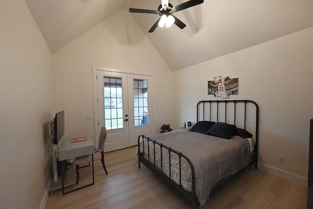 bedroom with french doors, light wood-style flooring, a ceiling fan, baseboards, and vaulted ceiling