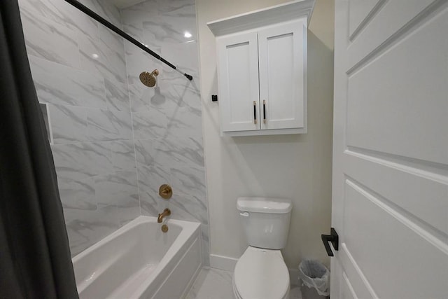 bathroom featuring bathtub / shower combination and toilet