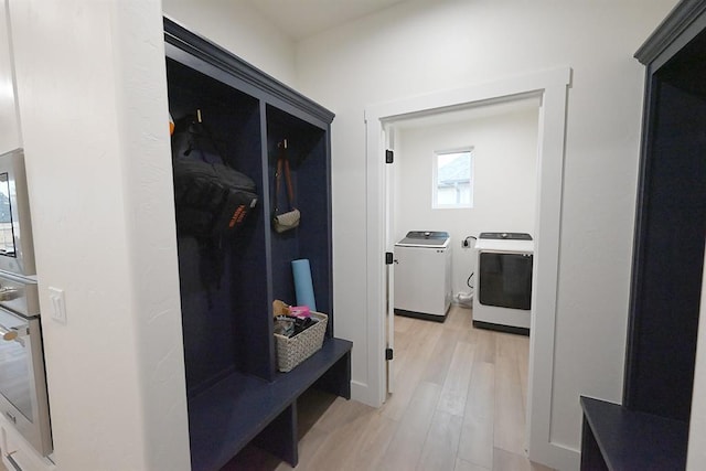 mudroom with washer / dryer and light wood-type flooring