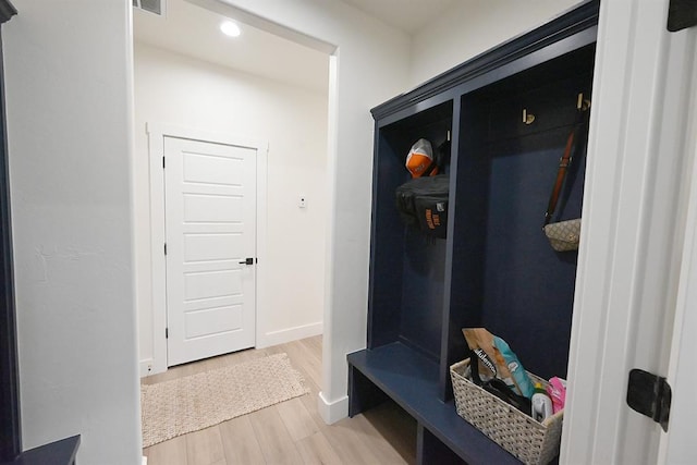 mudroom featuring light wood-type flooring, recessed lighting, and baseboards