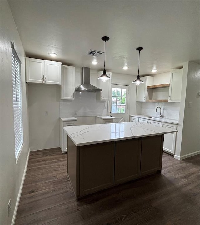 kitchen with open shelves, wall chimney exhaust hood, decorative backsplash, and white cabinetry