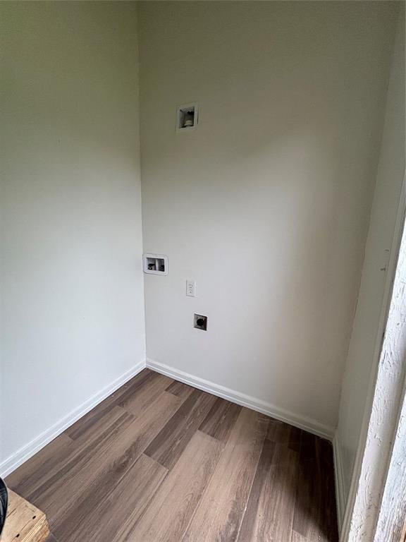 clothes washing area with laundry area, baseboards, hookup for a washing machine, dark wood finished floors, and hookup for an electric dryer
