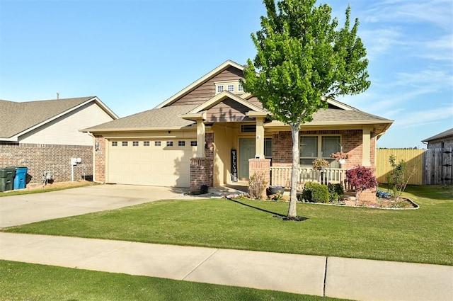 craftsman inspired home featuring a porch, driveway, brick siding, fence, and an attached garage