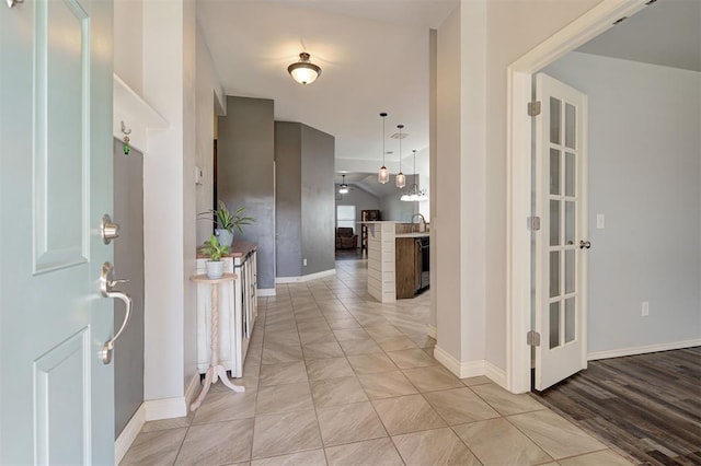 foyer featuring baseboards