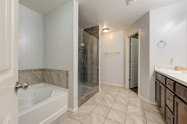 full bathroom with a garden tub, vanity, visible vents, and a shower stall