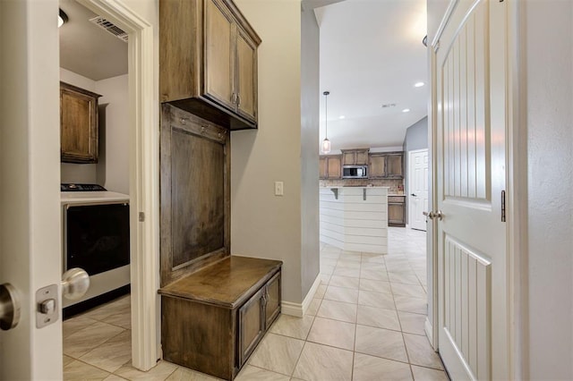 mudroom featuring light tile patterned floors, recessed lighting, and visible vents