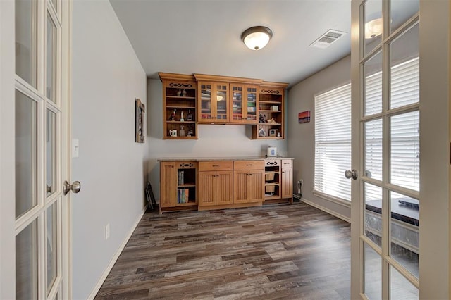 bar featuring french doors, baseboards, visible vents, and dark wood finished floors