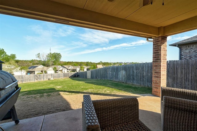 view of patio with a fenced backyard and a residential view