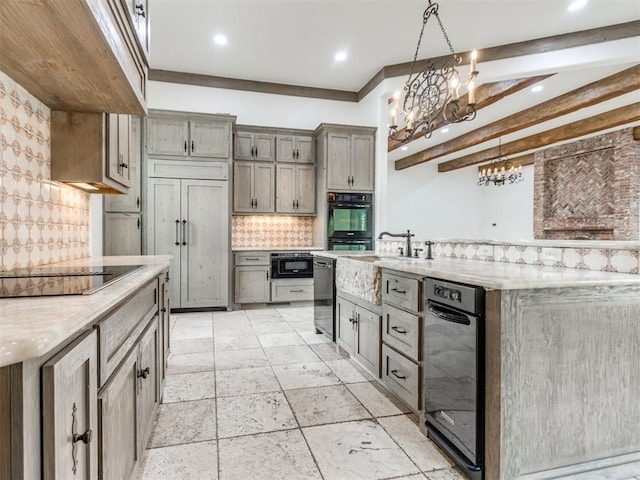 kitchen with tasteful backsplash, a sink, gray cabinetry, under cabinet range hood, and recessed lighting