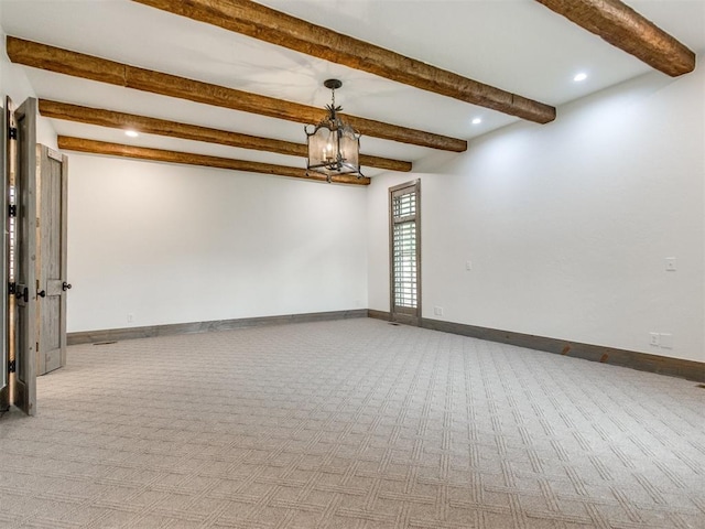 unfurnished room with an inviting chandelier, baseboards, carpet, and beam ceiling