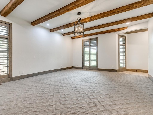 empty room with recessed lighting, beamed ceiling, an inviting chandelier, and light carpet
