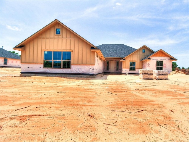 11673 Ward Rd, Edmond, OK 73034 - unfinished property with board and batten siding