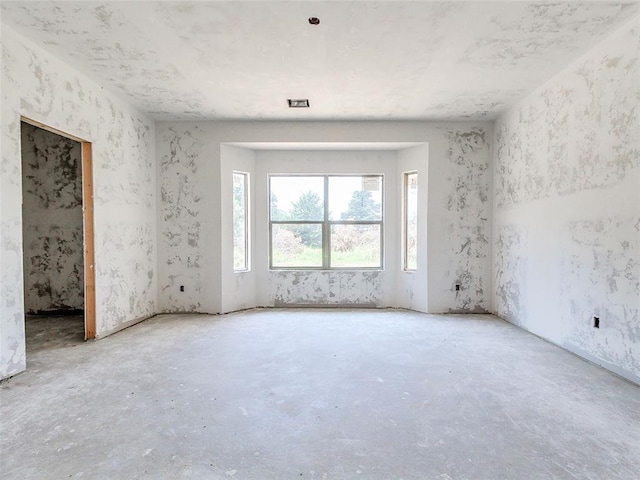 11673 Ward Rd, Edmond, OK 73034 - empty room featuring unfinished concrete flooring