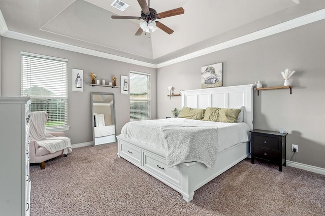carpeted bedroom featuring crown molding, baseboards, a tray ceiling, and visible vents
