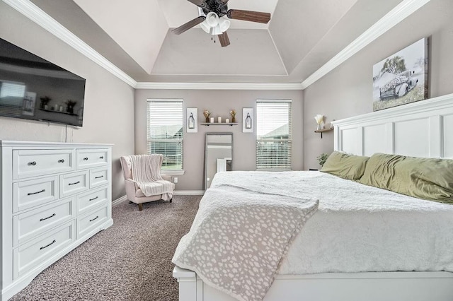 carpeted bedroom with a raised ceiling, ornamental molding, baseboards, and a ceiling fan