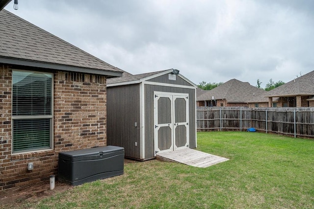 view of shed with a fenced backyard