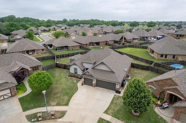 birds eye view of property with a residential view
