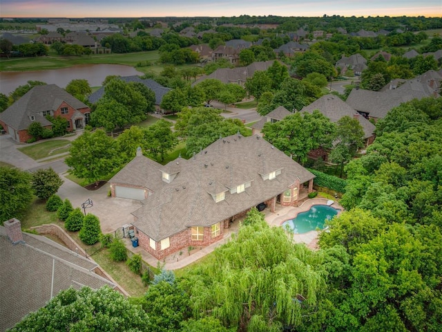 3125 Cumberland Dr, Edmond, OK 73034 - aerial view at dusk of a water view, view of pool area, and a residential view