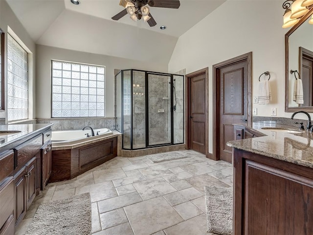3125 Cumberland Dr, Edmond, OK 73034 - full bath featuring lofted ceiling, a shower stall, a ceiling fan, a garden tub, and two vanities