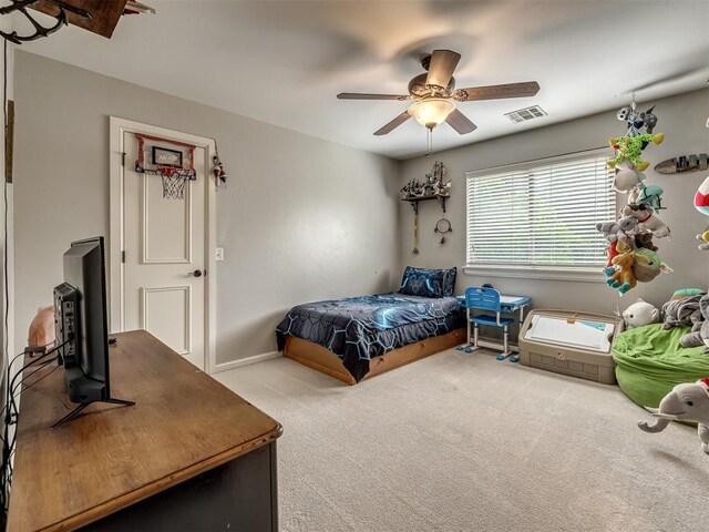 3125 Cumberland Dr, Edmond, OK 73034 - carpeted bedroom featuring ceiling fan and baseboards