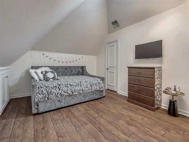 3125 Cumberland Dr, Edmond, OK 73034 - bedroom featuring lofted ceiling, wood-type flooring, and baseboards